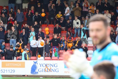 180426 - Cheltenham Town v Newport County - Sky Bet League 2 - Fans of Newport County cheer their team onto the field
