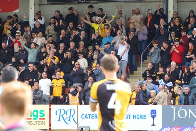 180426 - Cheltenham Town v Newport County - Sky Bet League 2 - Fans of Newport County cheer their team onto the field