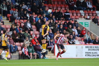 180426 - Cheltenham Town v Newport County - Sky Bet League 2 - Lee Jenkins of Newport County wins a high ball