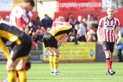180426 - Cheltenham Town v Newport County - Sky Bet League 2 - Matt Baker of Newport County is dejected at the final whistle