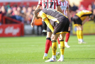 180426 - Cheltenham Town v Newport County - Sky Bet League 2 - Harrison Biggins of Newport County is dejected at the final whistle