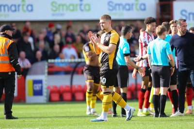 180426 - Cheltenham Town v Newport County - Sky Bet League 2 - Cole Jarvis of Newport County applauds the travelling fans at the end of the game