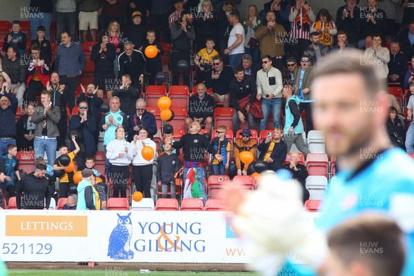 180426 - Cheltenham Town v Newport County - Sky Bet League 2 - Fans of Newport County cheer their team onto the field