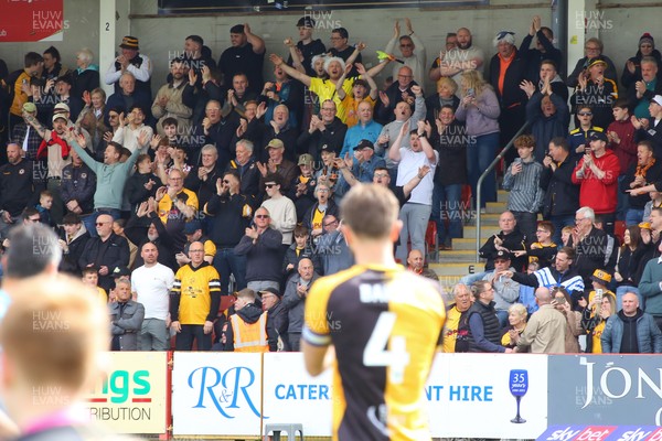 180426 - Cheltenham Town v Newport County - Sky Bet League 2 - Fans of Newport County cheer their team onto the field