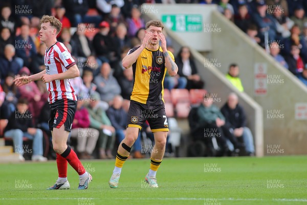 180426 - Cheltenham Town v Newport County - Sky Bet League 2 - Cameron Evans of Newport County sees his shot turned away for a corner
