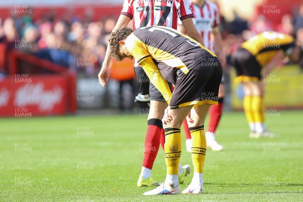 180426 - Cheltenham Town v Newport County - Sky Bet League 2 - Harrison Biggins of Newport County is dejected at the final whistle