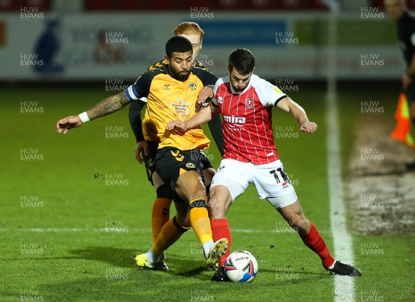 190121 - Cheltenham Town v Newport County, Sky Bet League 2 - Joss Labadie of Newport County and Matty Blair of Cheltenham Town compete for the ball