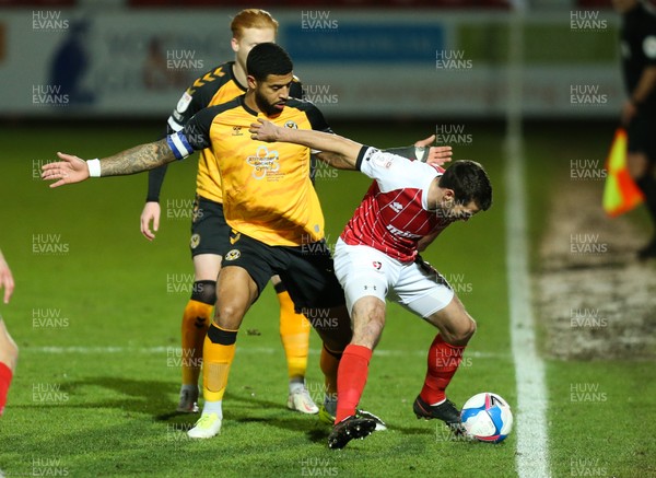 190121 - Cheltenham Town v Newport County, Sky Bet League 2 - Joss Labadie of Newport County and Matty Blair of Cheltenham Town compete for the ball