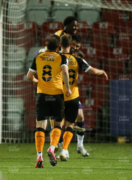 190121 - Cheltenham Town v Newport County, Sky Bet League 2 - Newport County players celebrate with Newport County goalkeeper Tom King after he scores a long range goal from his own penalty area