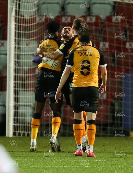 190121 - Cheltenham Town v Newport County, Sky Bet League 2 - Newport County players celebrate with Newport County goalkeeper Tom King after he scores a long range goal from his own penalty area