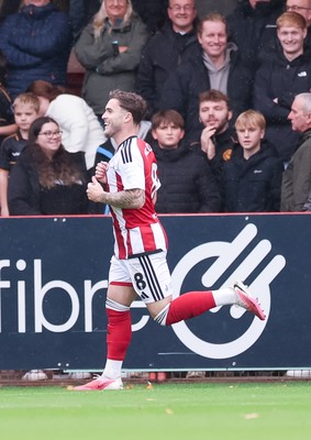 241026 Cheltenham Town v Newport County, EFL Sky Bet League 2 -  Charlie McCann of Cheltenham Town celebrates after scoring goal