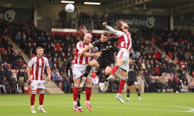 241026 Cheltenham Town v Newport County, EFL Sky Bet League 2 -  Lee Jenkins of Newport County looks to head at goal