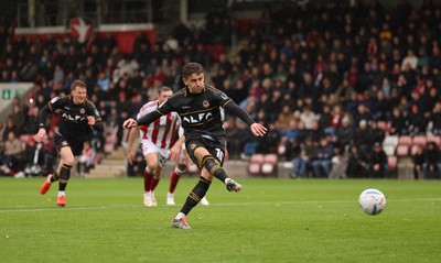 241026 Cheltenham Town v Newport County, EFL Sky Bet League 2 - Harrison Biggins of Newport County takes penalty which is saved by Wyll Stanway of Cheltenham Town