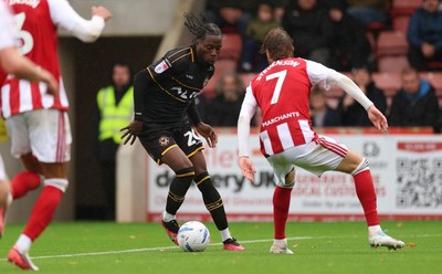 241026 Cheltenham Town v Newport County, EFL Sky Bet League 2 - Yahya Bamba of Newport County shoots as Ben Stevenson of Cheltenham Town closes in