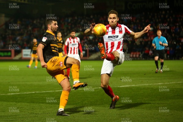 241118 - Cheltenham Town v Newport County - EFL SkyBet League 2 - Padraig Amond of Newport County and Chris Hussey of Cheltenham Town compete for a high ball
