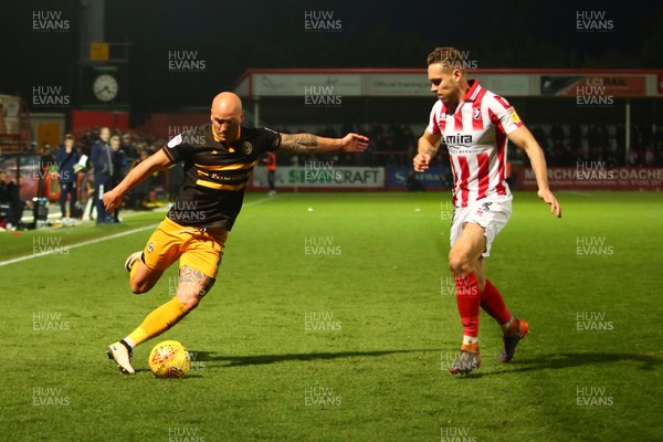 241118 - Cheltenham Town v Newport County - EFL SkyBet League 2 - David Pipe of Newport County takes on Chris Hussey of Cheltenham Town