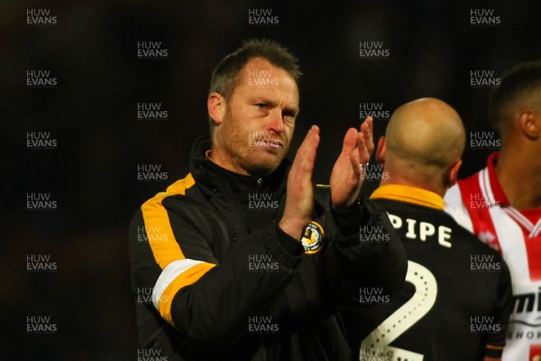 241118 - Cheltenham Town v Newport County - EFL SkyBet League 2 - A dejected Michael Flynn of Newport County applauds the traveling fans