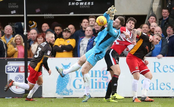 301217 - Cheltenham Town v Newport County - SkyBet League Two - Joe Day of Newport County gathers the ball