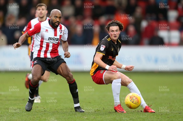 301217 - Cheltenham Town v Newport County - SkyBet League Two - Tom Owen-Evans of Newport County is challenged by Nigel Atangana of Cheltenham Town