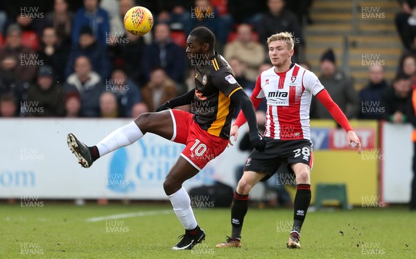 301217 - Cheltenham Town v Newport County - SkyBet League Two - Frank Nouble of Newport County is challenged by Taylor Moore of Cheltenham Town