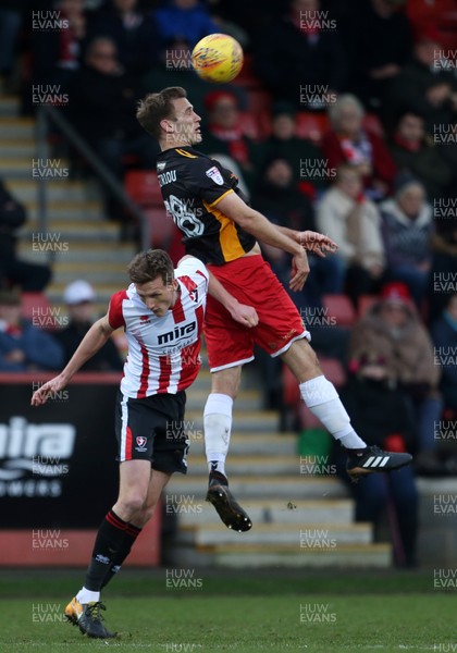 301217 - Cheltenham Town v Newport County - SkyBet League Two - Mickey Demetriou of Newport County goes up for the ball