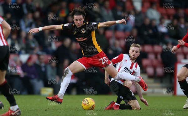 301217 - Cheltenham Town v Newport County - SkyBet League Two - Tom Owen-Evans of Newport County is challenged by Joe Morrell of Cheltenham Town