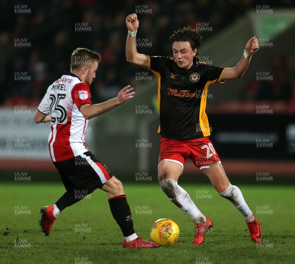 301217 - Cheltenham Town v Newport County - SkyBet League Two - Tom Owen-Evans of Newport County is tackled by Joe Morrell of Cheltenham Town