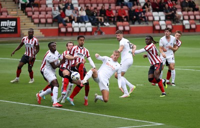 230725 - Cheltenham Town v Swansea City - Pre Season Friendly - Jay Fulton of Swansea City gets a foot to the ball