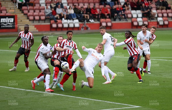 230725 - Cheltenham Town v Swansea City - Pre Season Friendly - Jay Fulton of Swansea City gets a foot to the ball