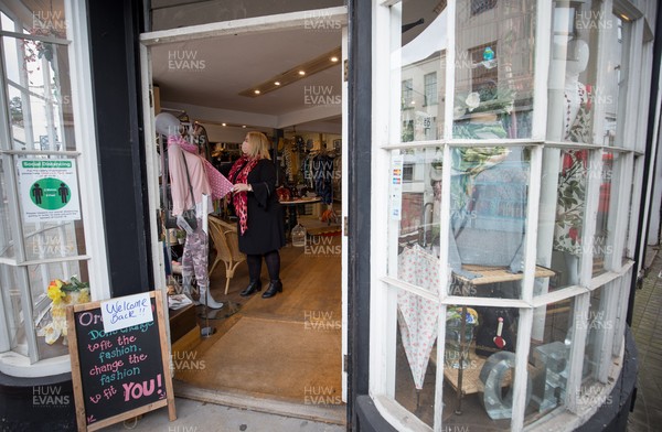 120421 Wales COVID 19 Restrictions Easing - Natalie Davies, owner of Orchard fashion in Chepstow, back trading in her shop for the first time this year as Wales eases lockdown restrictions allowing the opening of non-essential shops