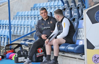 080325 - Chesterfield v Newport County - Sky Bet League 2 - Newport County head coach Nelson Jardim talks to head of performance Scott Wickens before the start of the match