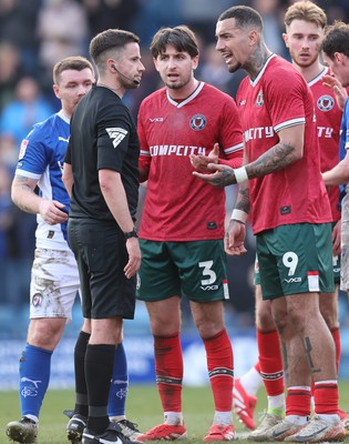 080325 - Chesterfield v Newport County - Sky Bet League 2 - Anthony Glennon of Newport and Courtney Baker-Richardson of Newport confront referee Michael Barlow at the end of the match