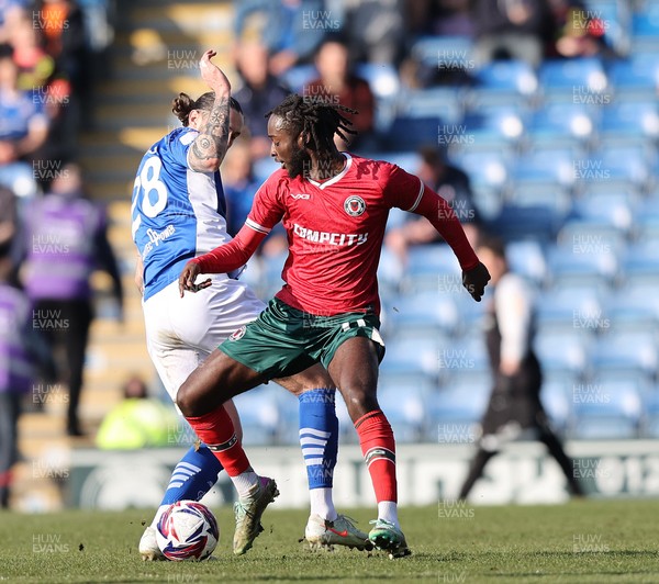 080325 - Chesterfield v Newport County - Sky Bet League 2 - Cameron Antwi of Newport and Ollie Banks of Chesterfield