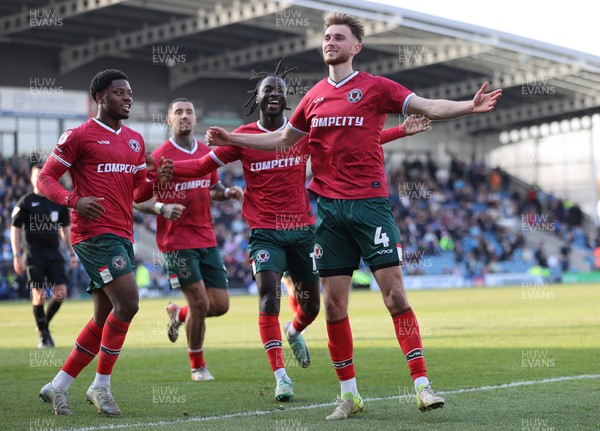 080325 - Chesterfield v Newport County - Sky Bet League 2 - Matt Baker of Newport celebrates scoring the 1st goal of the match with Cameron Antwi of Newport and Bobby Kamwa of Newport