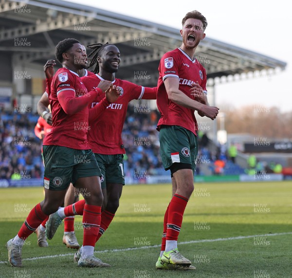 080325 - Chesterfield v Newport County - Sky Bet League 2 - Matt Baker of Newport celebrates scoring the 1st goal of the match with Cameron Antwi of Newport and Bobby Kamwa of Newport