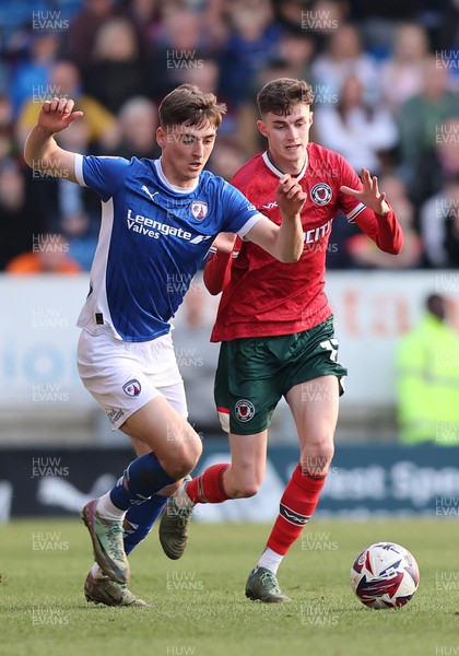 080325 - Chesterfield v Newport County - Sky Bet League 2 - Joe Thomas of Newport and Dylan Duffy of Chesterfield