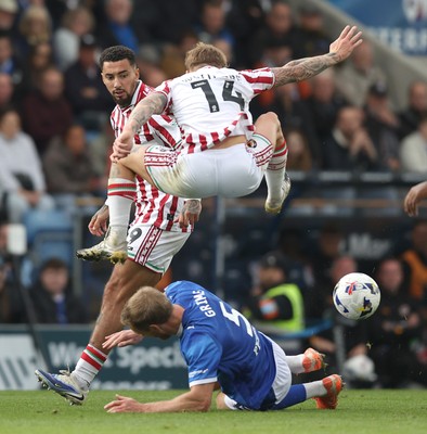 270925 - Chesterfield v Newport County - Sky Bet League 2 - Kai Whitmore of Newport leaps over Jamie Grimes of Chesterfield in the 2nd half