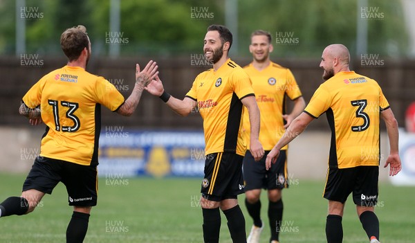 180717 - Chippenham FC v Newport County - Pre Season Friendly - Robbie Willmott of Newport County celebrates scoring a goal with team mates