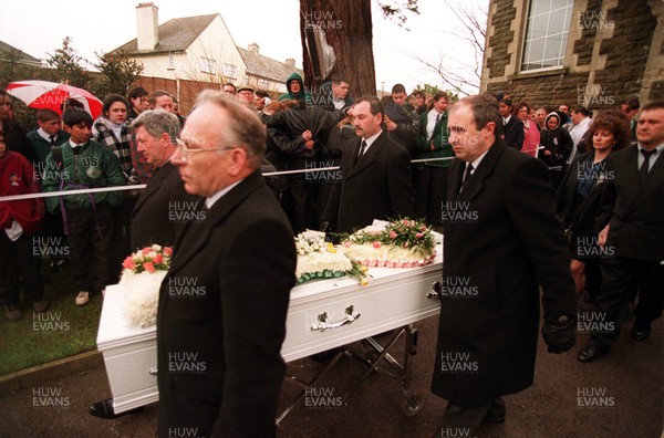 170395 - Claire Hood Funeral - Friends watch as the coffin leaves chapel service