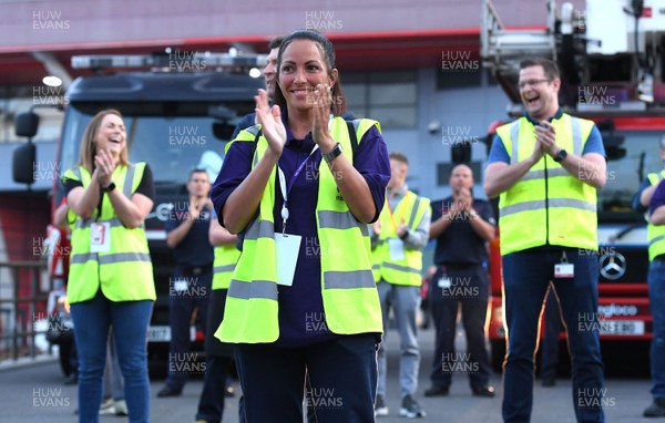 230420 - Clap for Carers - Workers outside temporary field hospital Dragon's Heart Hospital at Principality Stadium taking part in Thursday evenings "Clap for Carers" at 8pm