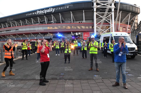 230420 - Clap for Carers - Workers outside temporary field hospital Dragon's Heart Hospital at Principality Stadium taking part in Thursday evenings "Clap for Carers" at 8pm
