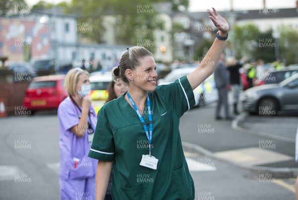 230420 - Picture shows hospital staff alongside the other emergency services and the public outside the Royal Gwent Hospital, Newport taking part in a clap for carers workers during the coronavirus (covid-19) lockdown