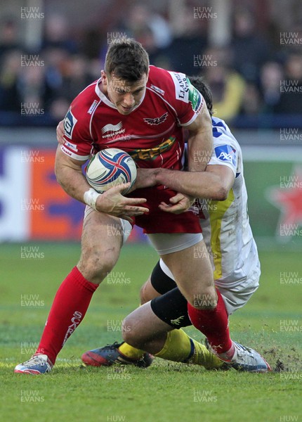 071213 - Clermont Auvergne v Scarlets - Heineken Cup - Gareth Davies of Scarlets is tackled by Thierry Lacrampe of Clermont  