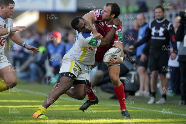 071213 - Clermont Auvergne v Scarlets - Heineken Cup - Frazier Climo of Scarlets is tackled into touch by Sitiveni Sivivatu of Clermont 