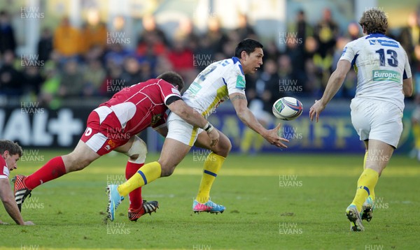 071213 - Clermont Auvergne v Scarlets - Heineken Cup - Regan King of Clermont is tackled by Samson Lee of Scarlets 