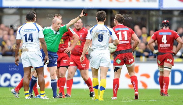 131012 - Clermont Auvergne v Scarlets - Heineken Cup -Referee Peter Fitzgibbon shows Morgan Stoddart of Scarlets a yellow card