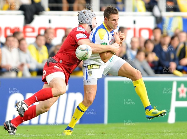 131012 - Clermont Auvergne v Scarlets - Heineken Cup -Lee Byrne of Clermont Auvergne is tackled by Jonathan Davies of Scarlets