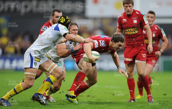 131012 - Clermont Auvergne v Scarlets - Heineken Cup -George North of Scarlets is tackled by Julien Bonnaire and Gerhard Vosloo of Clermont Auvergne