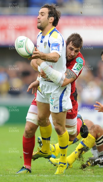 131012 - Clermont Auvergne v Scarlets - Heineken Cup -Morgan Parra of Clermont Auvergne is tackled by Josh Turnbull of Scarlets