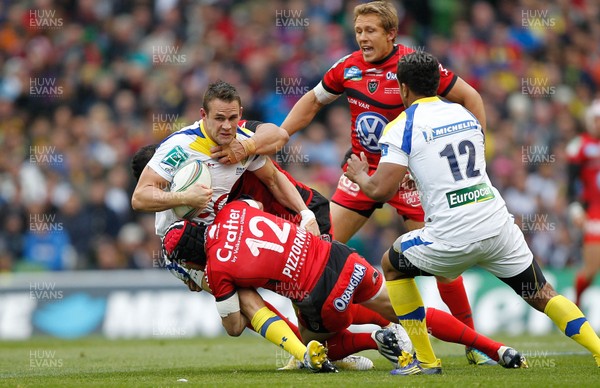 180513 - ASM Clermont Auvergne v Toulon - Heineken Cup Final - Lee Byrne of Clermont is tackled by Chris Masoe and Matt Giteau of Toulon  